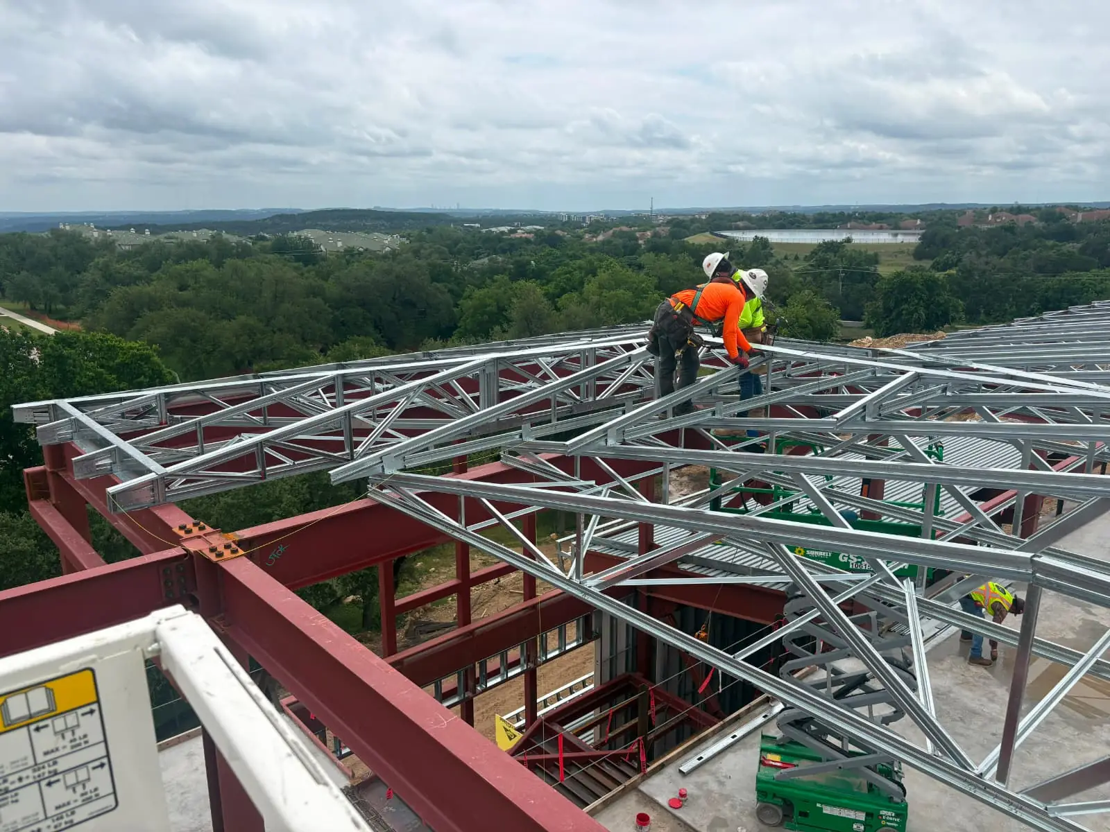Framing crew working at height with full fall protection
